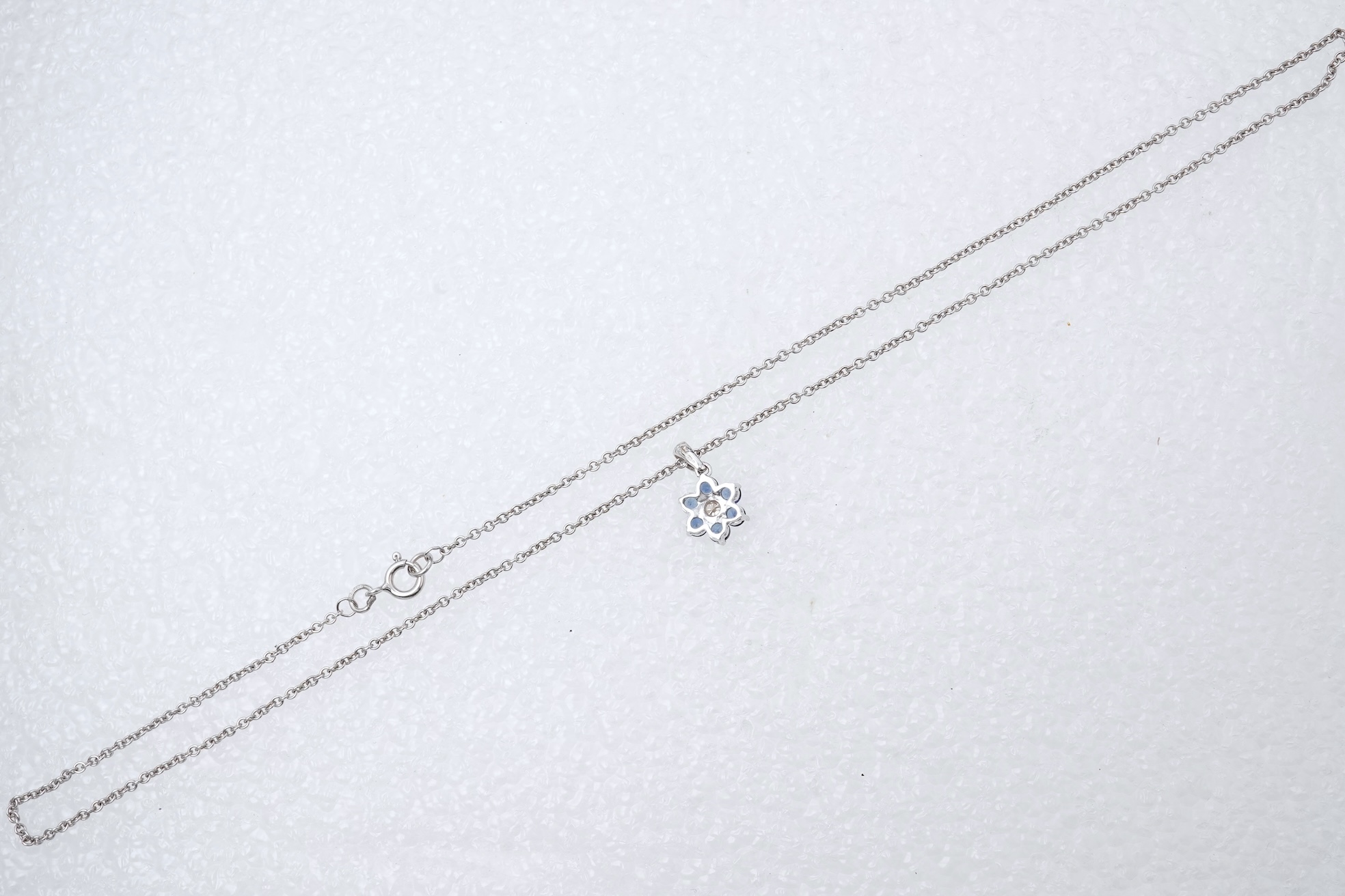 A sapphire and diamond pendant